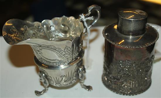 Embossed silver cylindrical tea caddy, Birmingham 1898 & a similar Edwardian cream jug